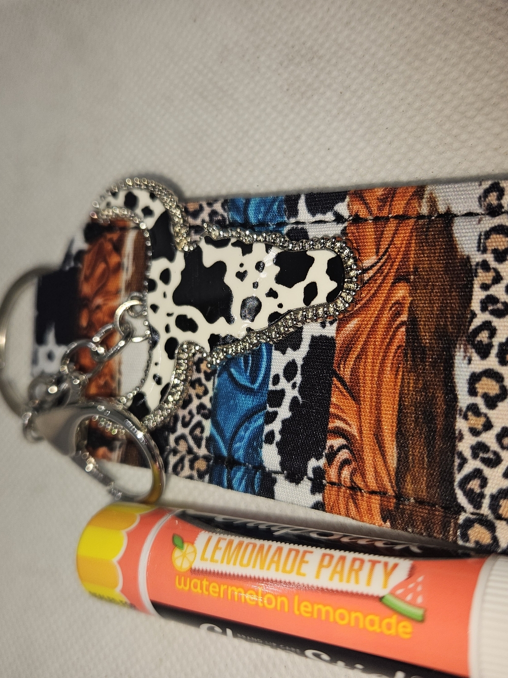 Cow Print Cross Keychain on Multicolor Fabric Lip Balm Holder